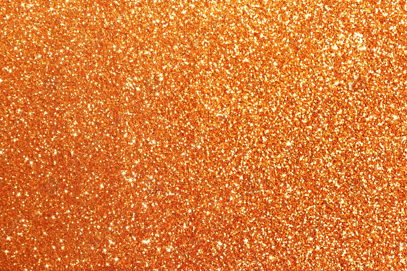 Image of Beautiful shiny orange glitter as background, closeup