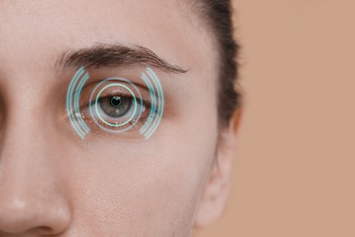 Vision test. Woman and digital scheme focused on her eye against beige background, closeup