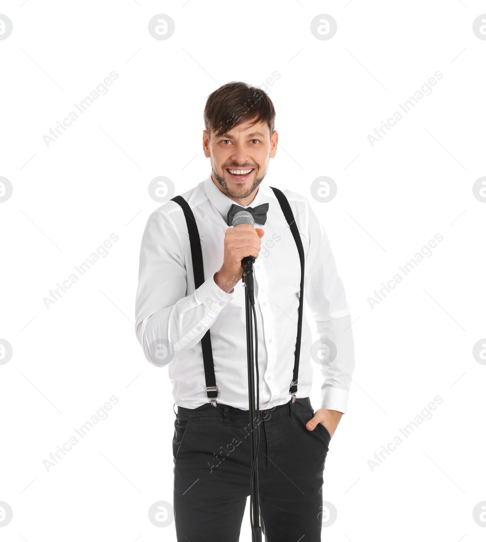 Photo of Handsome man in formal clothes posing with microphone on white background