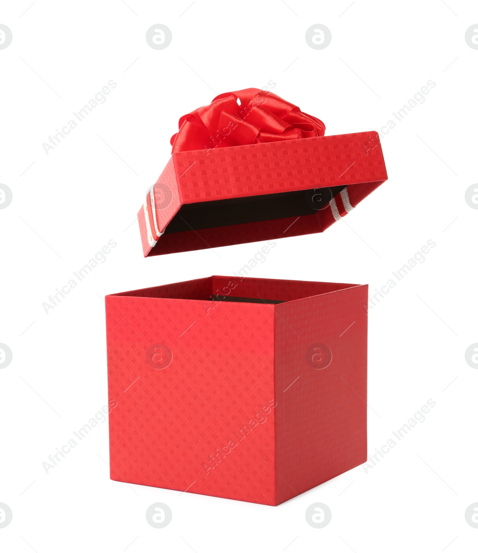 Photo of Red gift box and lid with bow on white background