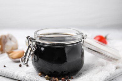 Organic balsamic vinegar and cooking ingredients on table, closeup