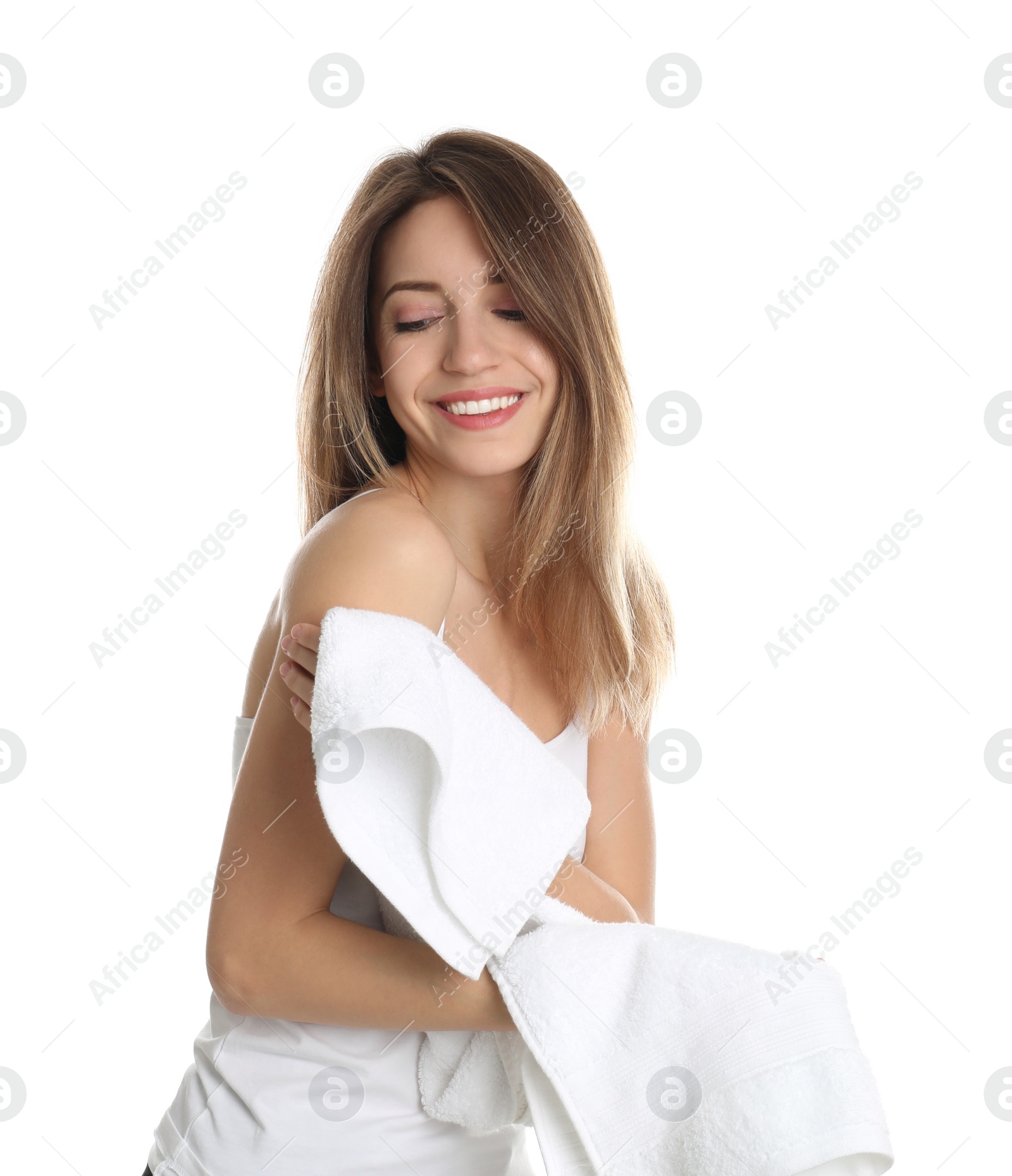 Photo of Young woman wiping body with towel on white background