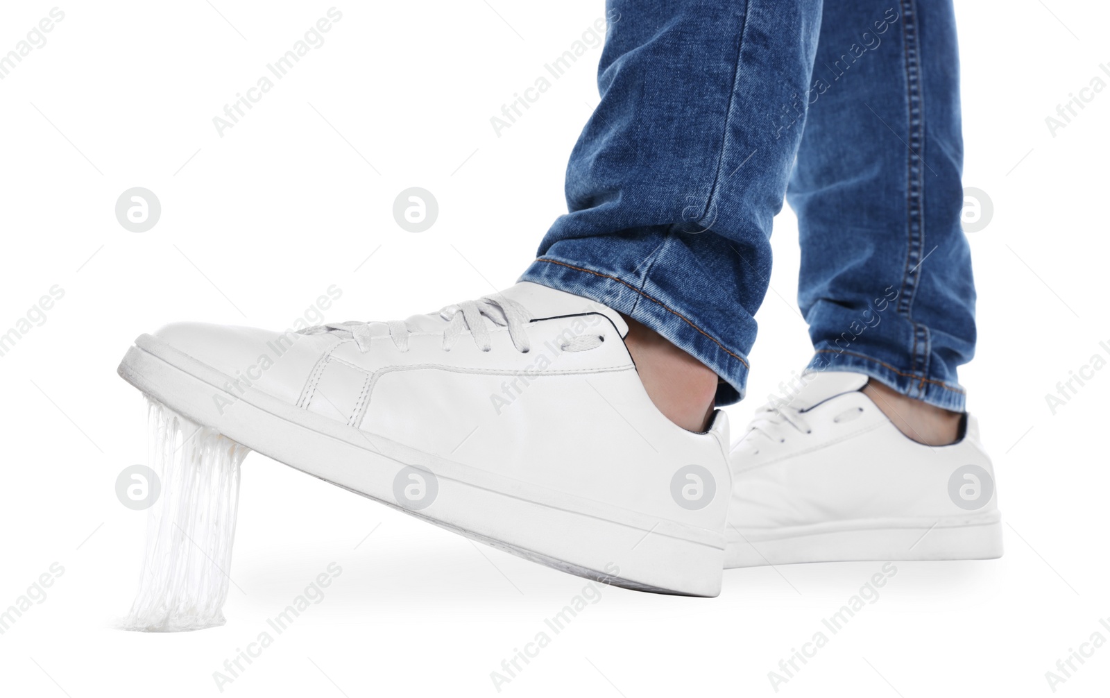 Photo of Person stepping into chewing gum on white background, closeup