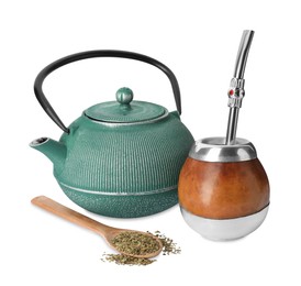 Photo of Calabash, bombilla, teapot and spoon with mate tea on white background