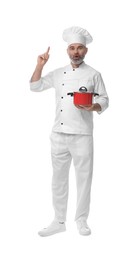 Photo of Surprised chef in uniform with cooking pot pointing at something on white background