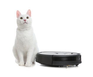 Photo of Modern robotic vacuum cleaner and cute cat on white background