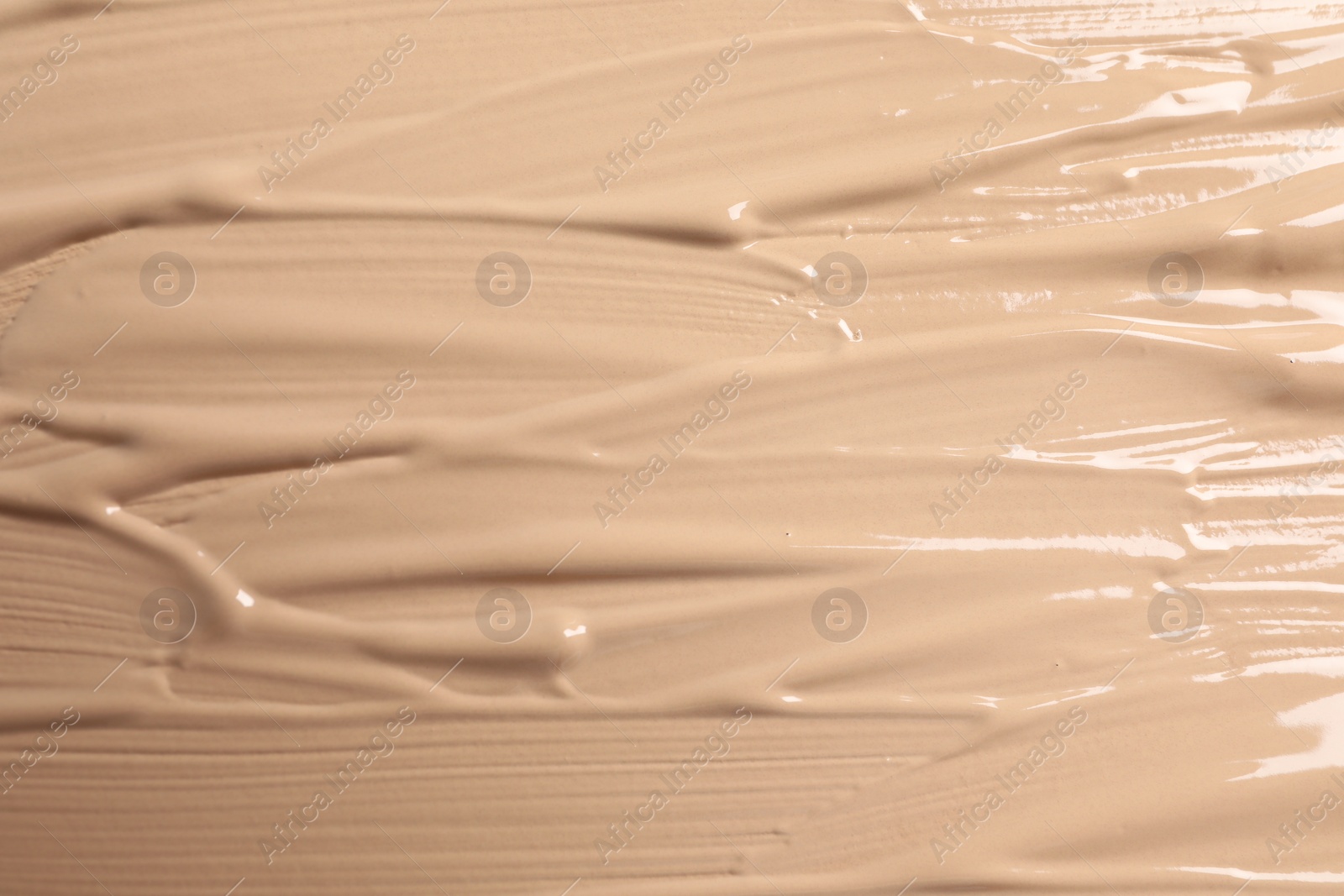 Photo of Texture of skin foundation as background, closeup