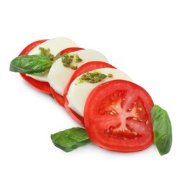 Photo of Tasty salad Caprese with mozzarella, tomatoes, basil and pesto sauce isolated on white