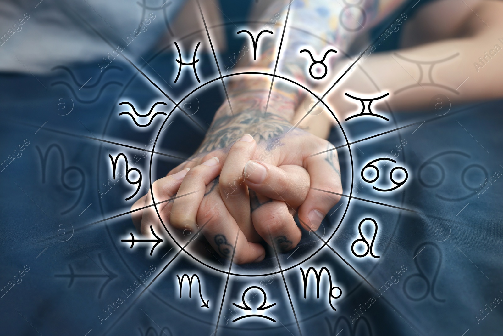 Image of Sexual compatibility. Zodiac wheel and passionate couple having sex on bed, closeup of hands