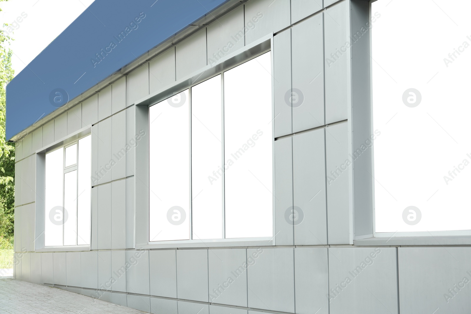 Photo of Blank banners on window outdoors. Advertising board design