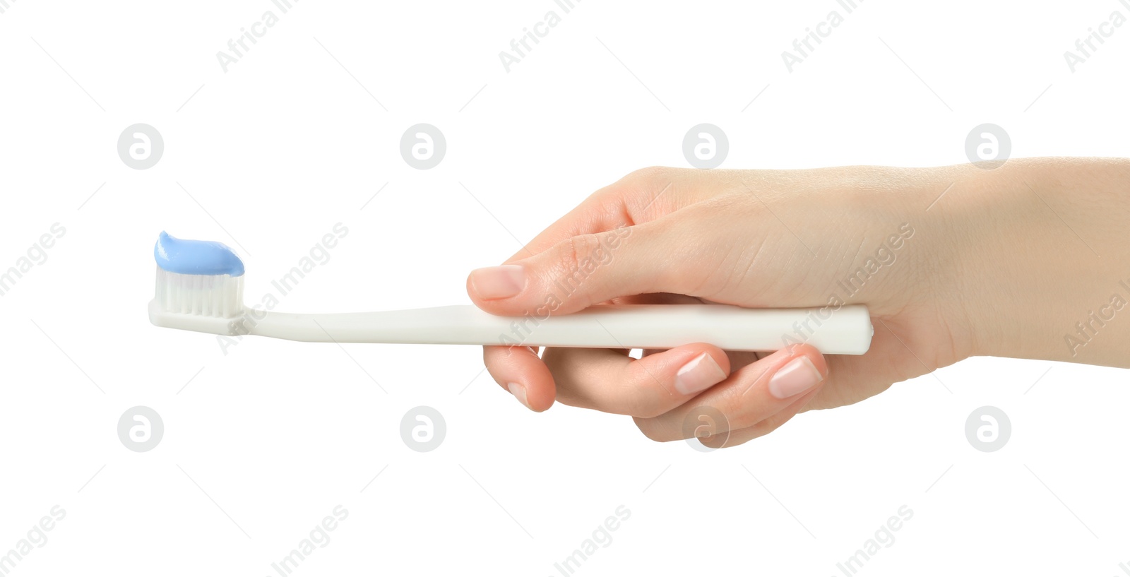 Photo of Woman holding toothbrush with paste on white background, closeup