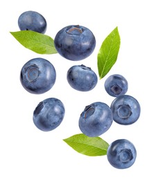 Image of Fresh ripe bilberries and green leaves falling on white background