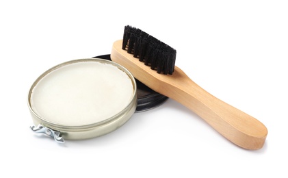 Wax polish with brush on white background. Shoe care accessories