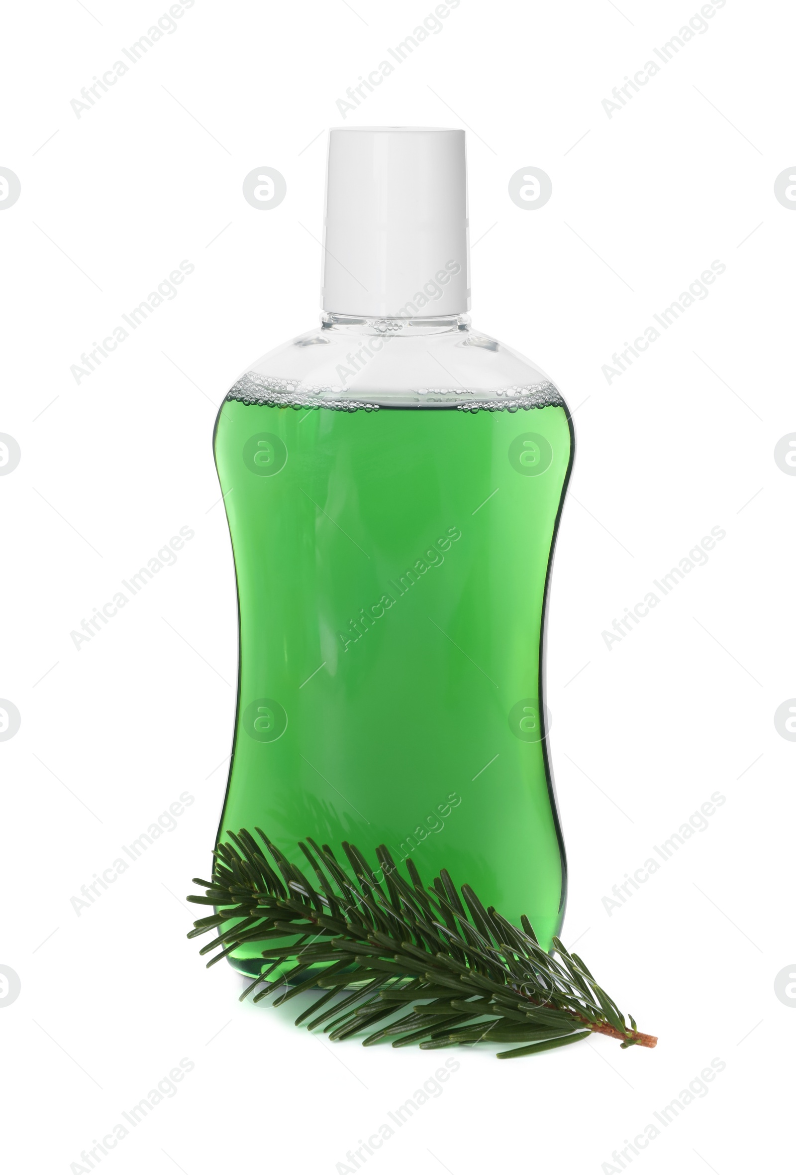 Photo of Bottle of mouthwash and fir twig isolated on white