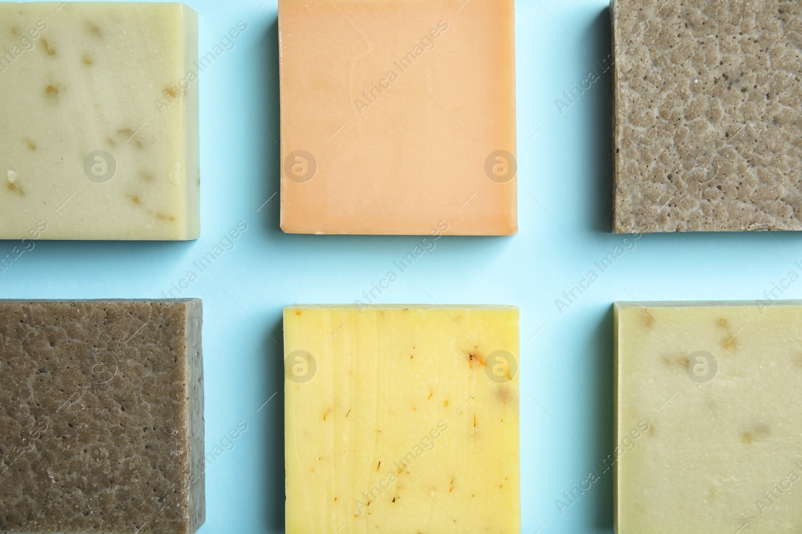 Photo of Hand made soap bars on color background, top view