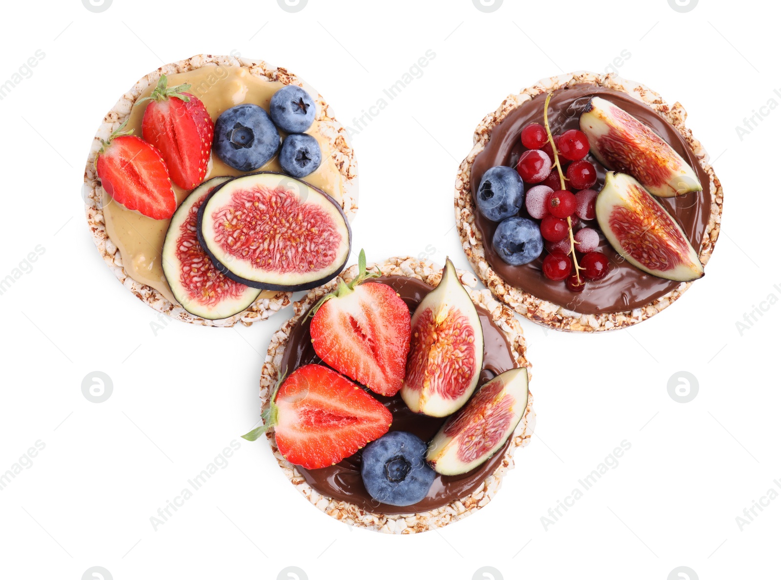 Photo of Tasty crispbreads with different toppings on white background, top view