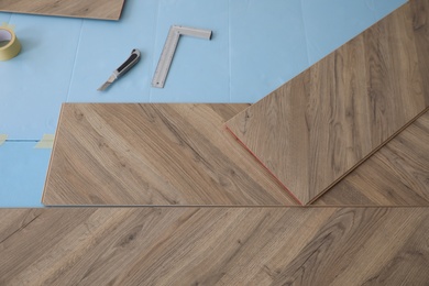 Installation of laminated wooden floor at home