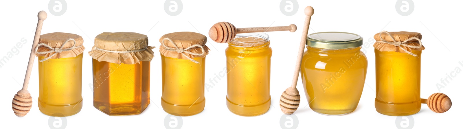 Image of Natural honey in glass jars and dippers isolated on white, set