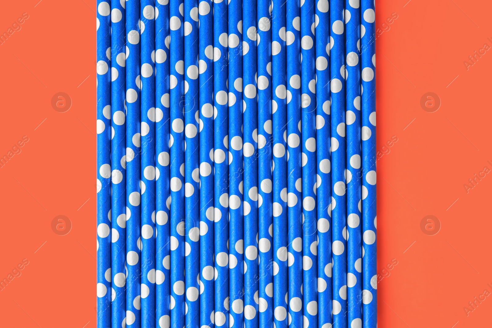 Photo of Many paper drinking straws on orange background, flat lay