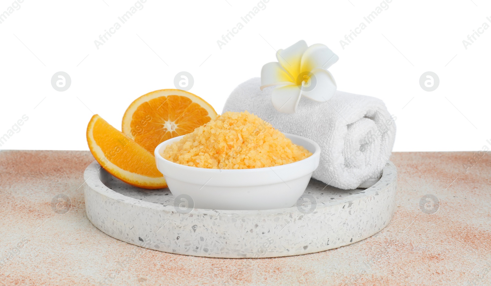 Photo of Composition with sea salt and towel on beige textured table against white background