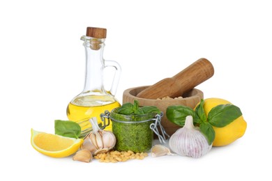 Photo of Delicious pesto sauce in jar and ingredients isolated on white