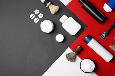 Photo of Flat lay composition with men's shaving accessories and space for text on color background