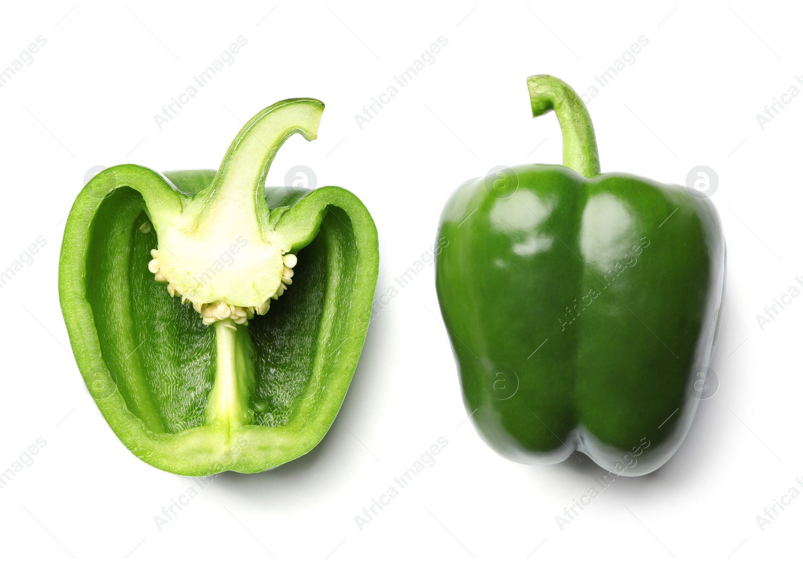 Photo of Whole and cut green bell peppers on white background, top view