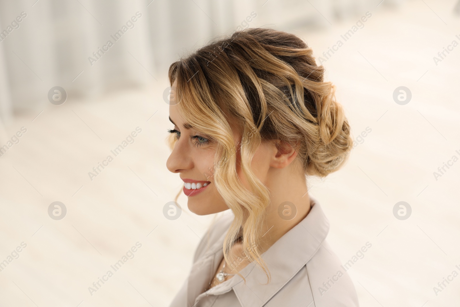 Photo of Smiling woman with beautiful hair style indoors