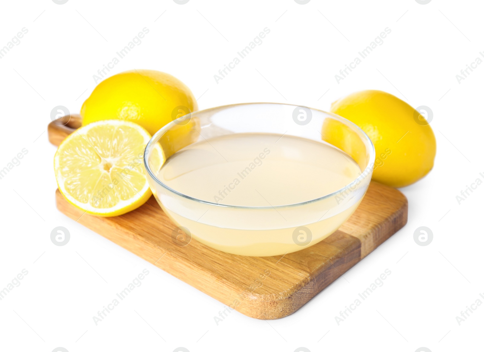 Photo of Freshly squeezed juice and lemons on white background