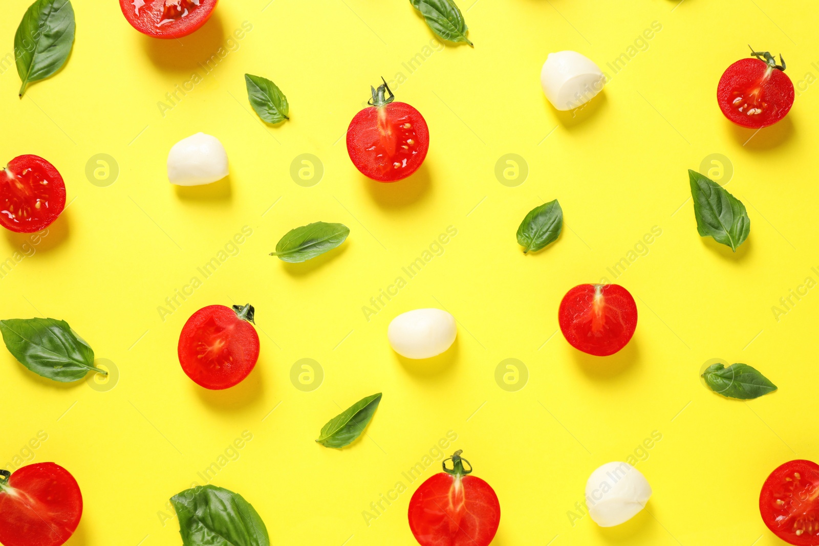 Photo of Flat lay composition with fresh ingredients for pizza on yellow background