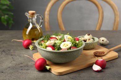 Delicious radish salad and ingredients on grey table