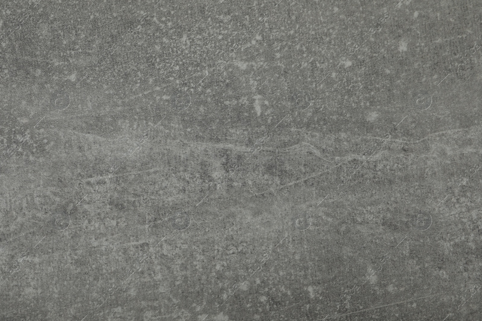 Photo of Texture of light grey stone surface as background, closeup