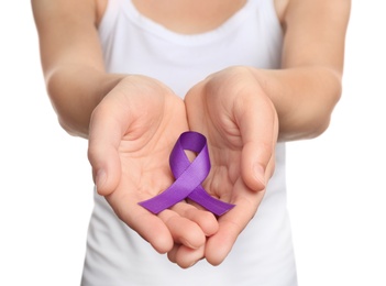 Photo of Woman holding purple ribbon on white background, closeup. Domestic violence awareness