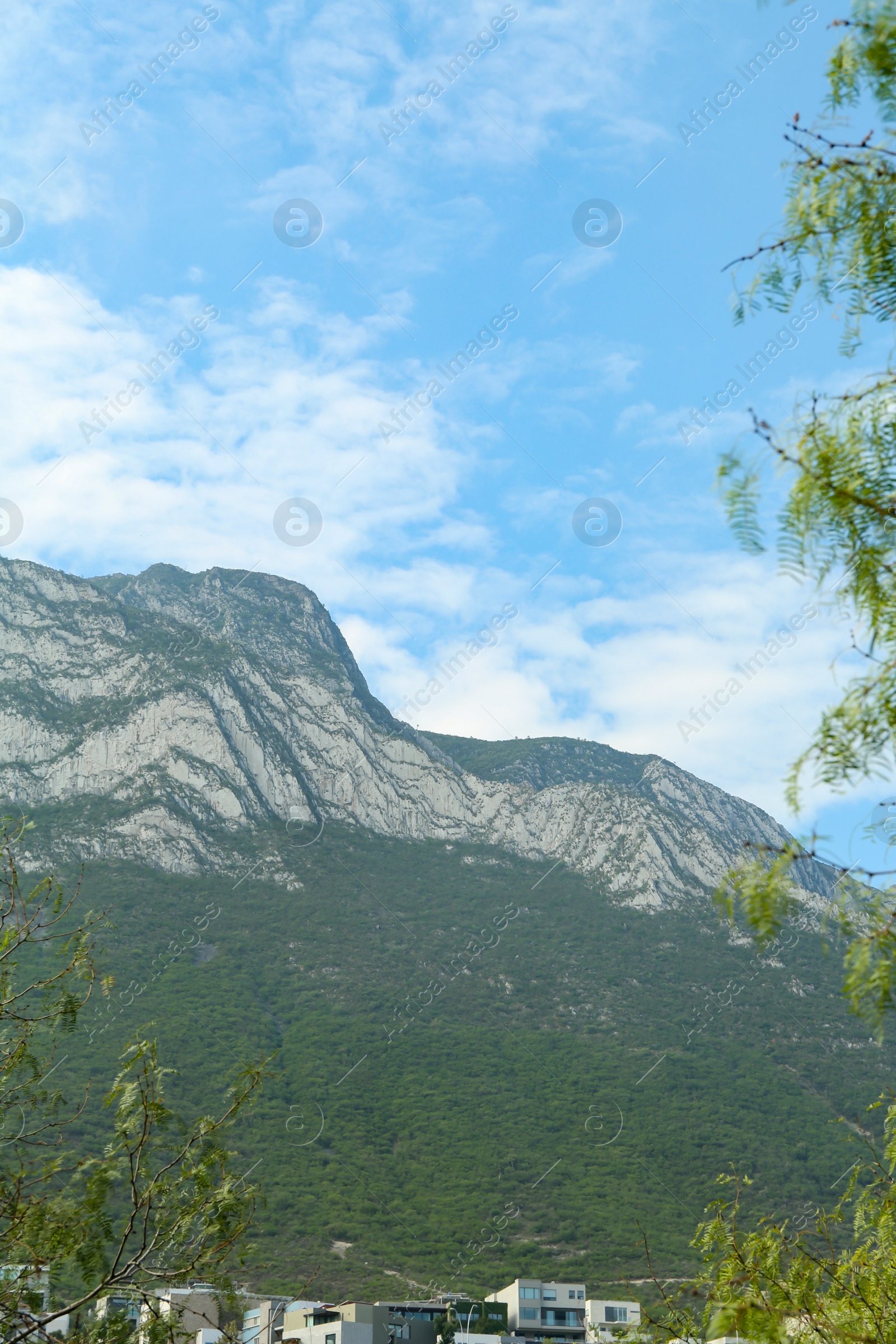 Photo of Town near beautiful mountain landscape under blue sky