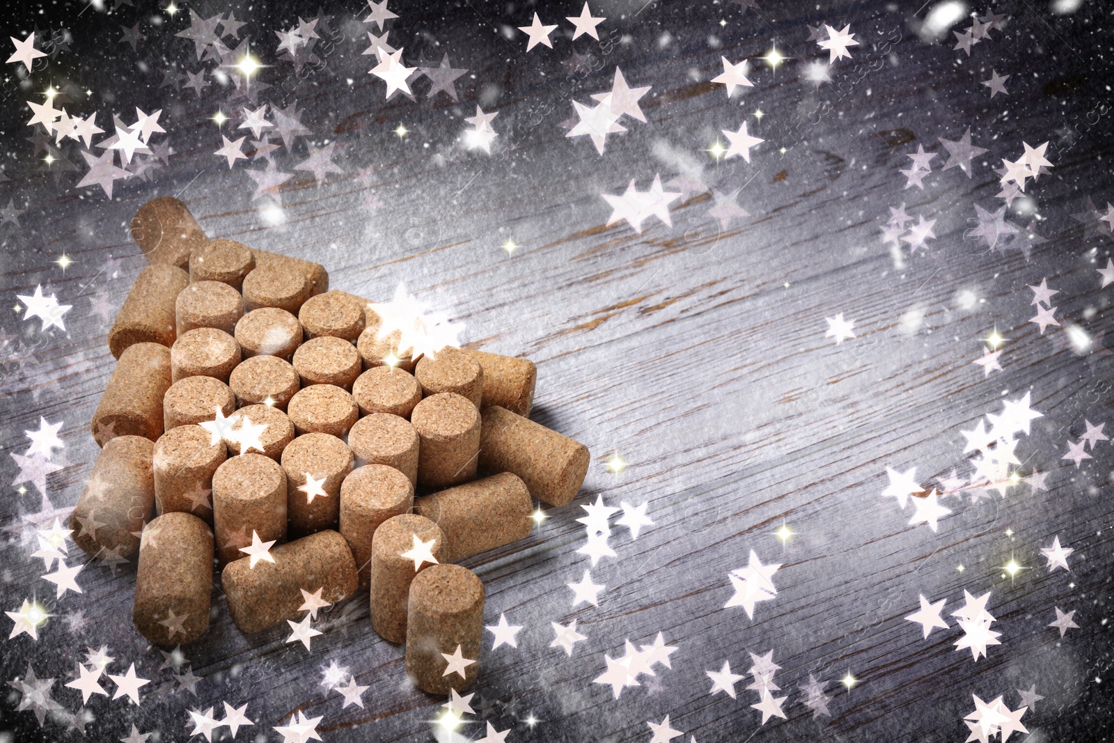 Image of Christmas tree made of wine corks on white wooden table. Space for text