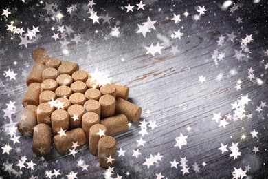 Christmas tree made of wine corks on white wooden table. Space for text
