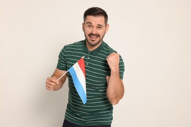 Photo of Man with flag of Netherlands on white background