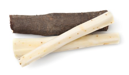 Cut raw salsify roots on white background, top view