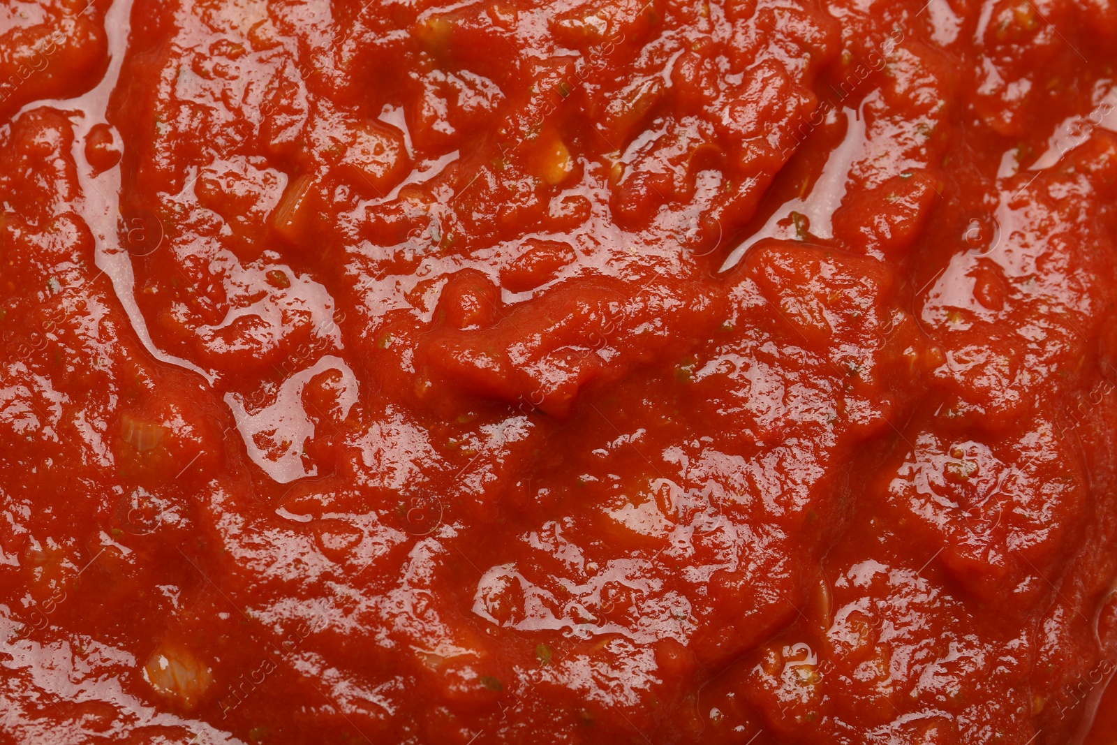 Photo of Homemade tomato sauce as background, top view