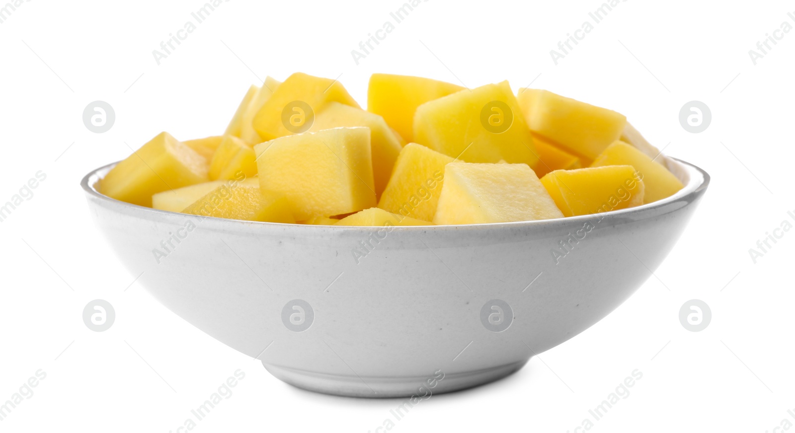 Photo of Tasty mango cubes in ceramic bowl isolated on white