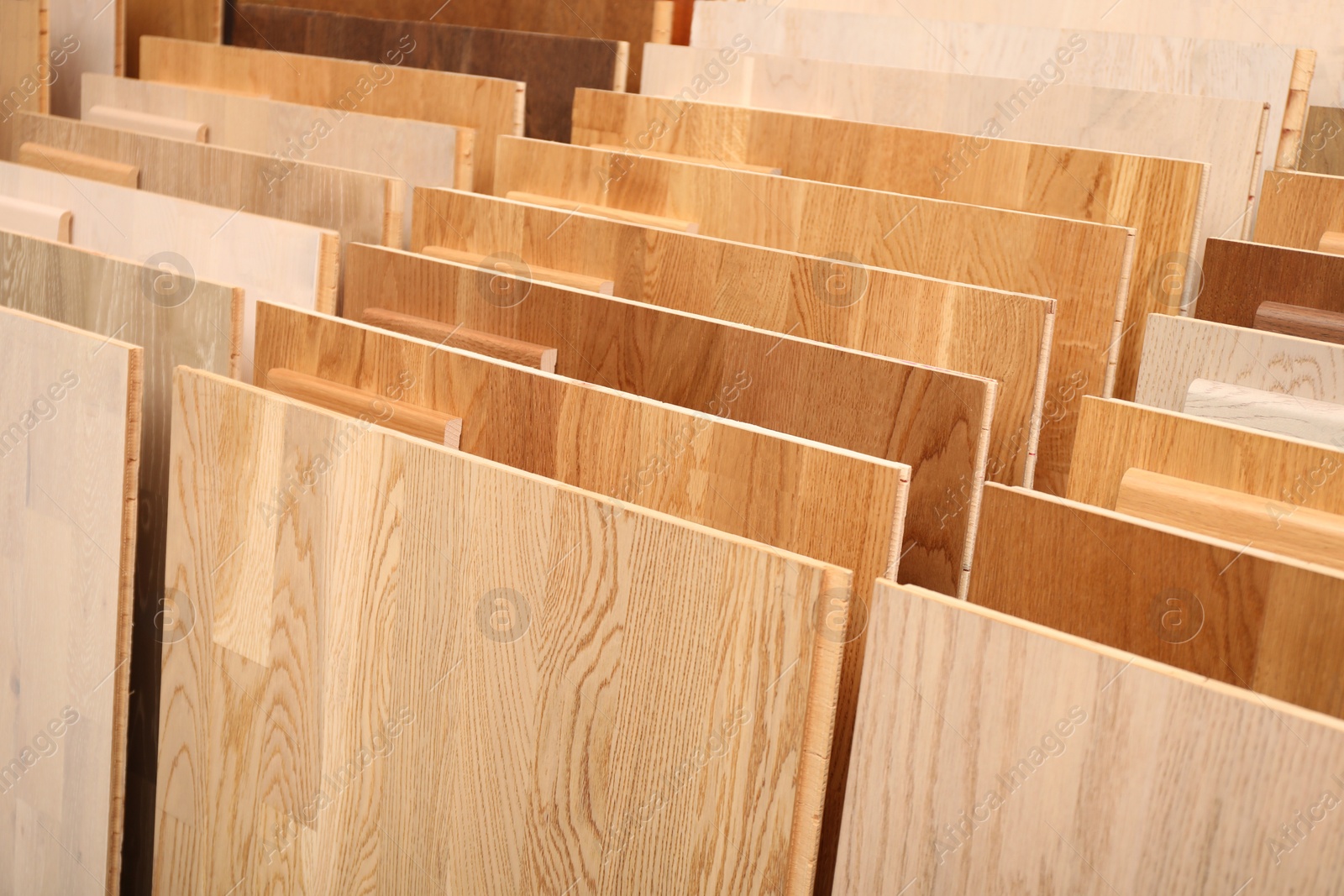 Photo of Many different samples of wooden flooring in store