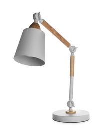 Photo of Stylish modern desk lamp isolated on white
