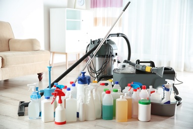 Photo of Professional cleaning supplies and equipment on floor indoors