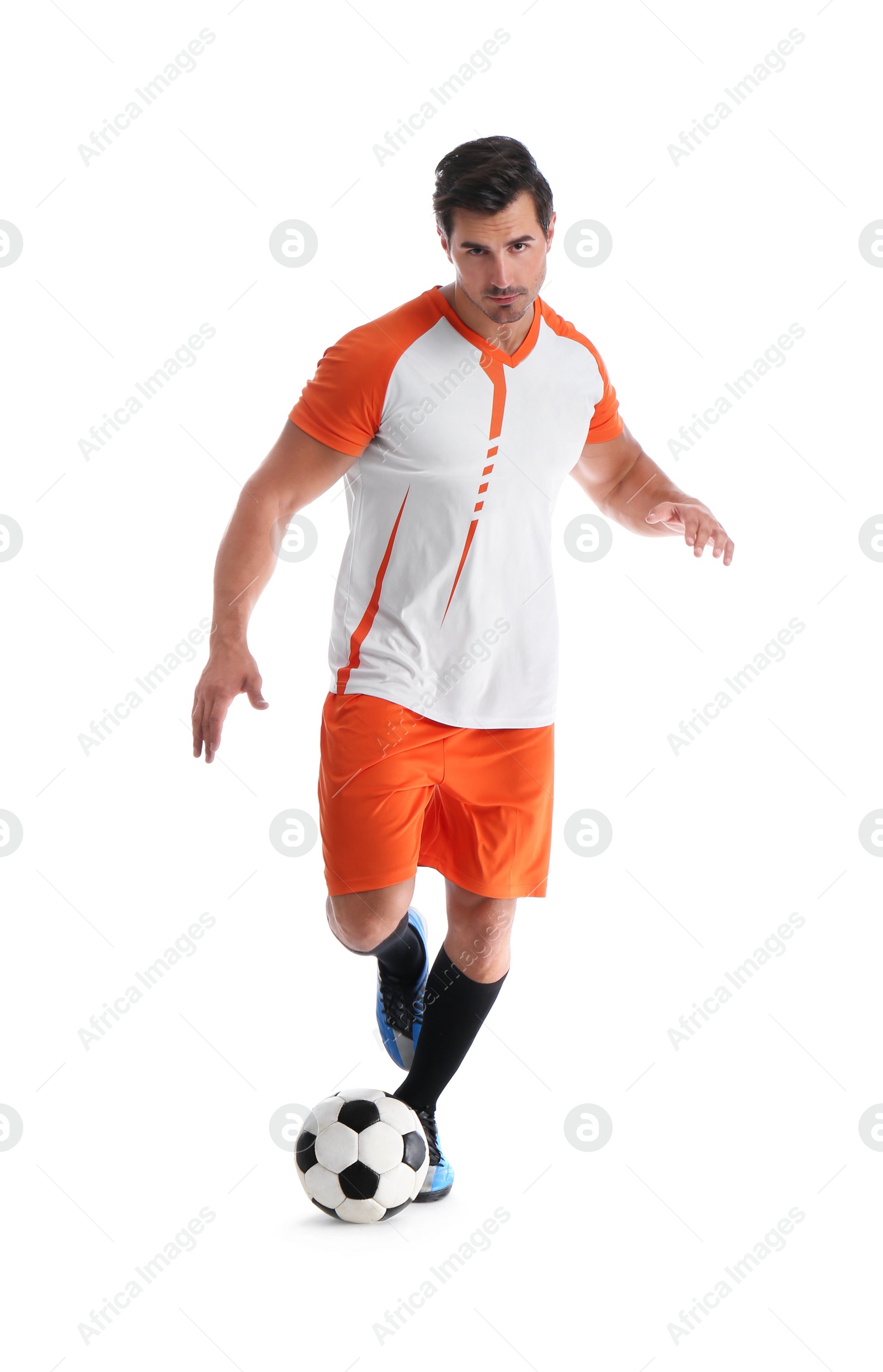 Photo of Young man playing football on white background