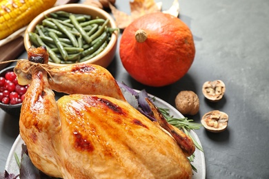 Photo of Composition with turkey on grey background, closeup. Happy Thanksgiving day