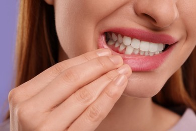 Woman showing her clean teeth, closeup view