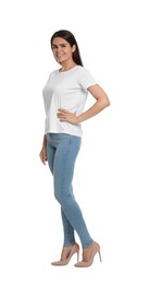 Happy woman wearing stylish light blue jeans and high heels shoes on white background