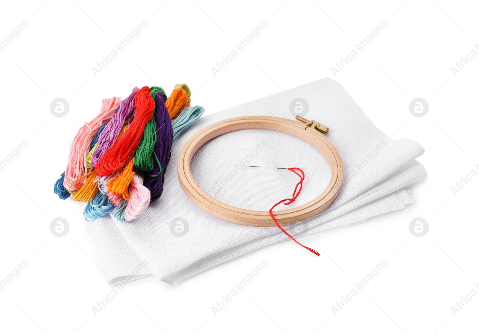 Photo of Set of embroidery equipment on white background