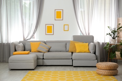 Photo of Living room with comfortable sofa and stylish decor. Idea for interior design