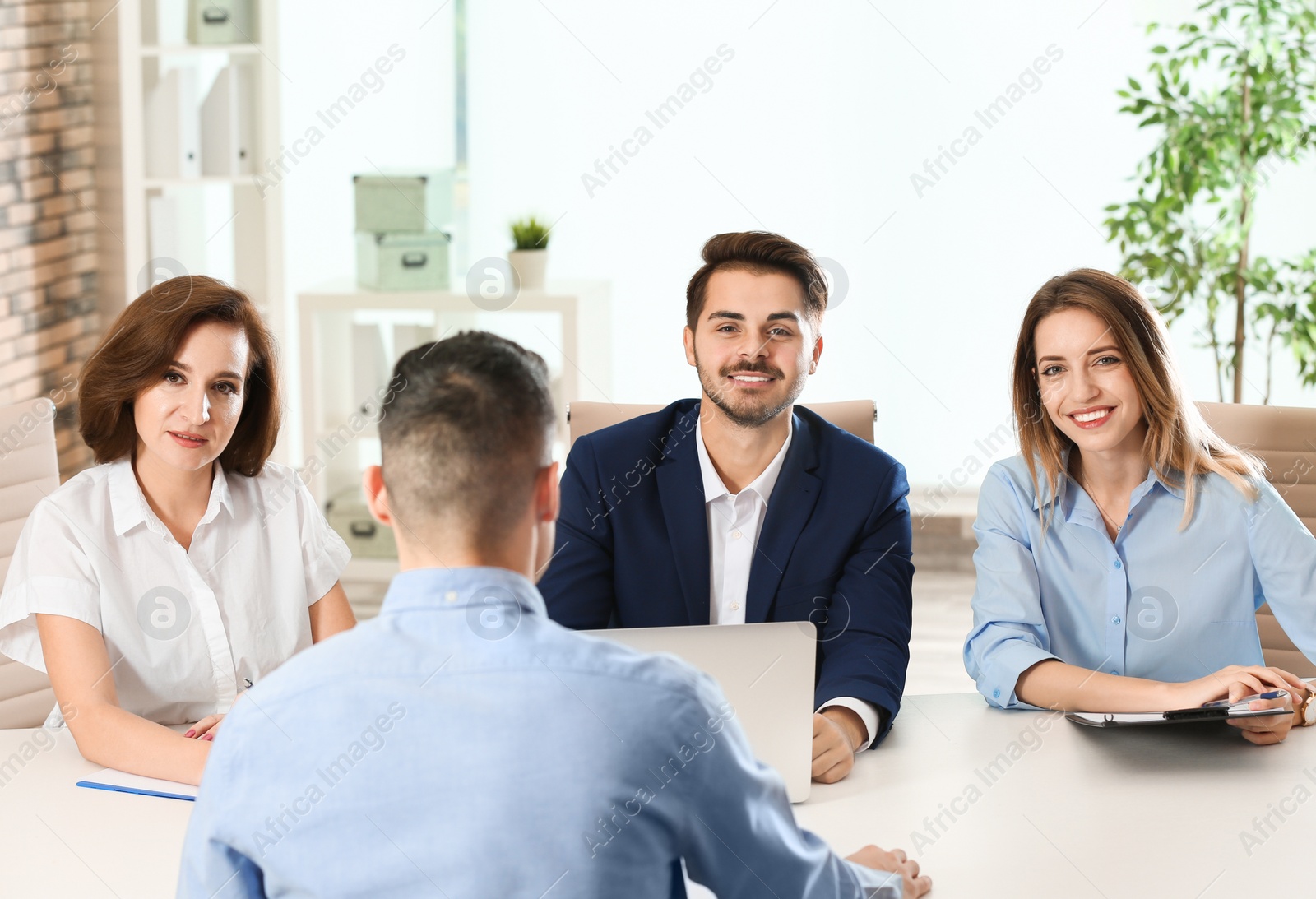 Photo of Human resources commission conducting job interview with applicant in office